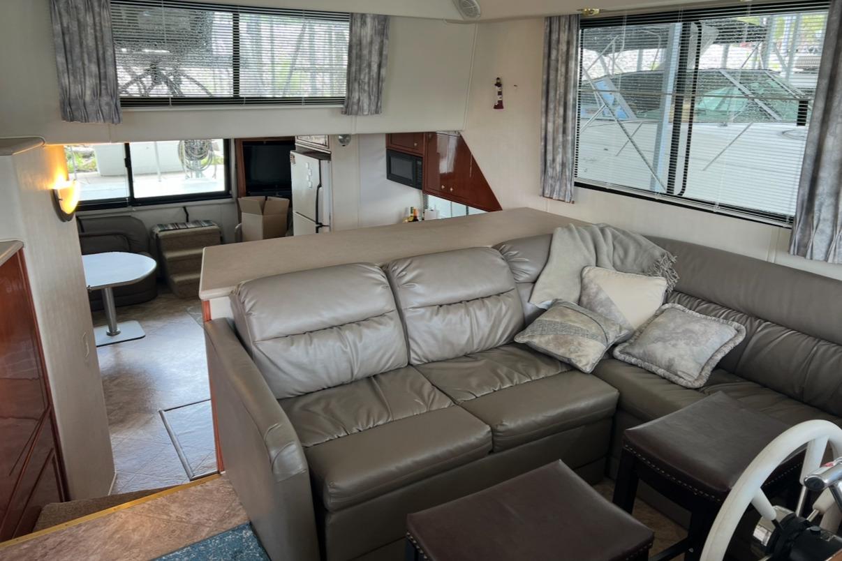 Interior of 2002 Harbor Master 440 Widebody yacht with leather seating and modern decor.