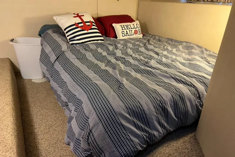 Lazy Susan Yacht Photos Pics Nautical-themed bedroom in 2002 Harbor Master 440 Widebody with anchor and sailor pillows.