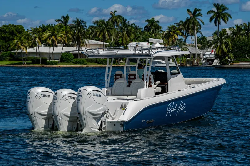  Yacht Photos Pics 2020 Everglades 395 Center Console boat with triple Yamaha engines on a sunny day.