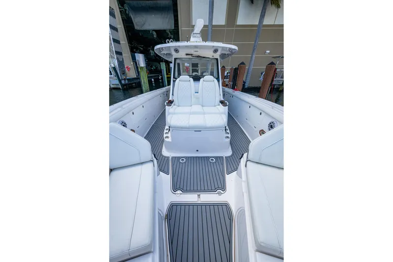  Yacht Photos Pics 2020 Everglades 395 Center Console boat interior with white seating and sleek design.