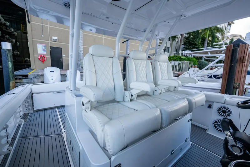  Yacht Photos Pics Luxurious seating on 2020 Everglades 395 Center Console boat, featuring white leather upholstery.