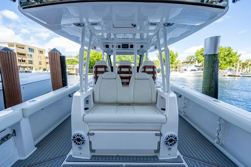  Yacht Photos Pics 2020 Everglades 395 Center Console boat interior with luxurious seating and waterfront view.