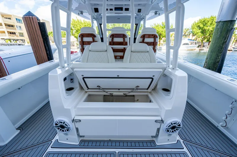  Yacht Photos Pics 2020 Everglades 395 Center Console boat interior with open storage compartment.