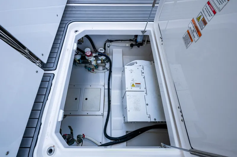  Yacht Photos Pics 2020 Everglades 395 Center Console boat compartment with mechanical components and wiring.