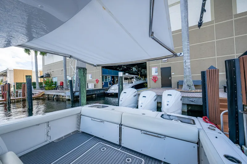  Yacht Photos Pics 2020 Everglades 395 Center Console boat docked with triple Yamaha engines.