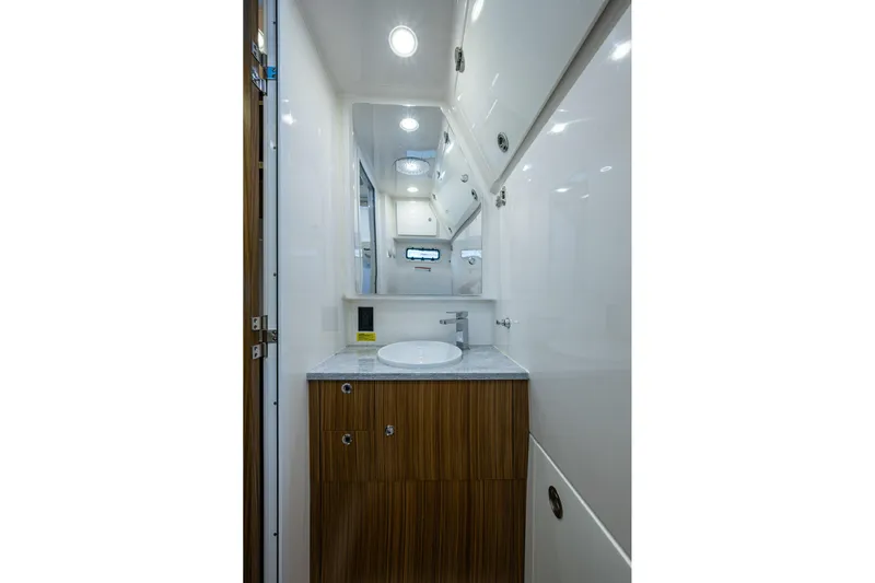  Yacht Photos Pics Luxurious bathroom interior of 2020 Everglades 395 Center Console boat.