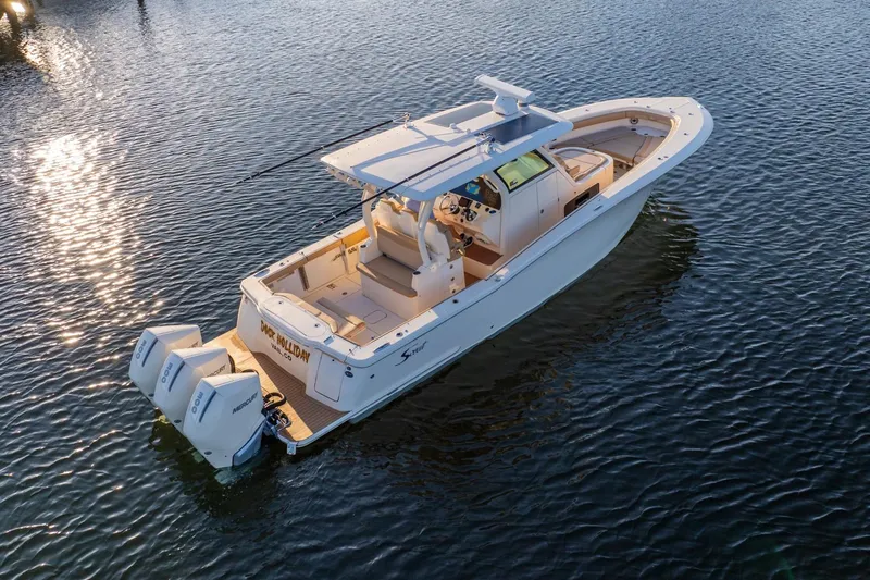  Yacht Photos Pics 2020 Scout 355 LXF boat on water with dual Mercury engines.