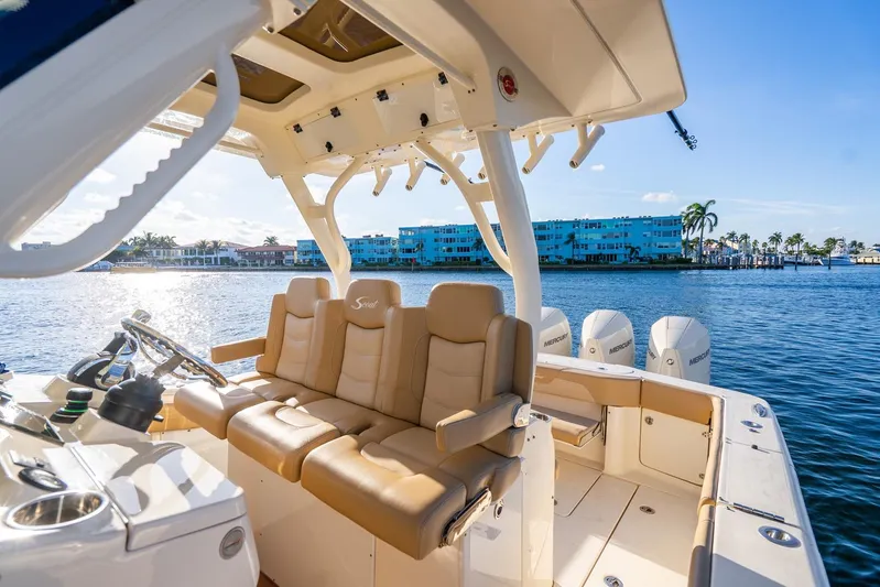  Yacht Photos Pics 2020 Scout 355 LXF boat interior with tan seating and ocean view.