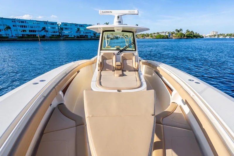  Yacht Photos Pics 2020 Scout 355 LXF boat on water, featuring luxurious seating and modern design.