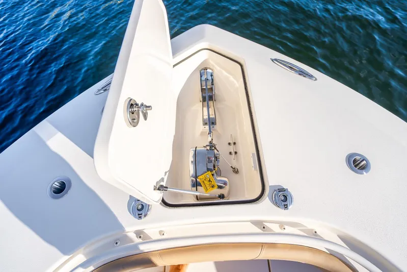  Yacht Photos Pics 2020 Scout 355 LXF boat anchor compartment open on calm water.