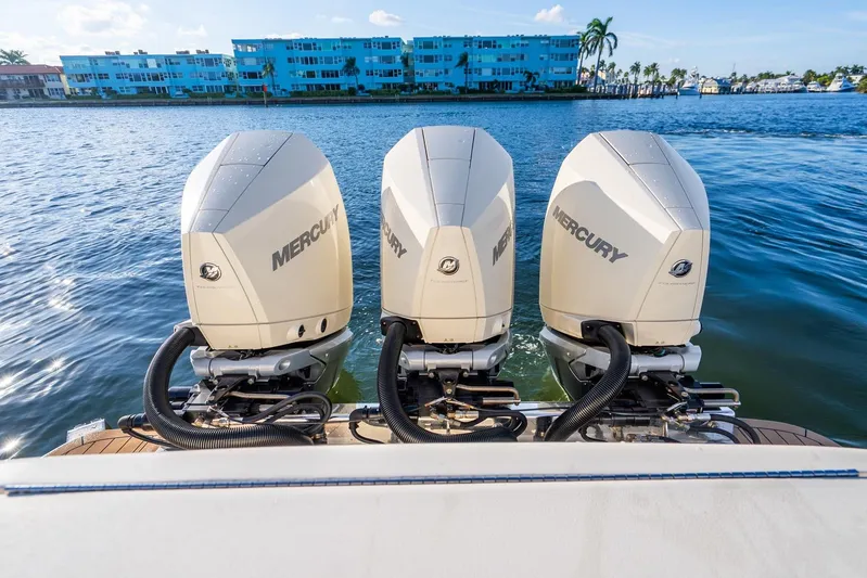  Yacht Photos Pics 2020 Scout 355 LXF boat with triple Mercury outboard engines on water.