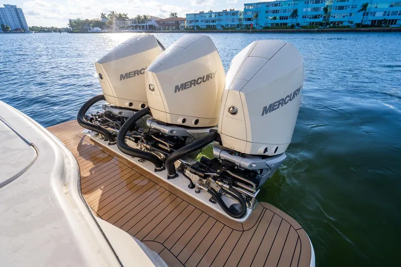  Yacht Photos Pics 2020 Scout 355 LXF boat with triple Mercury outboard engines on water.