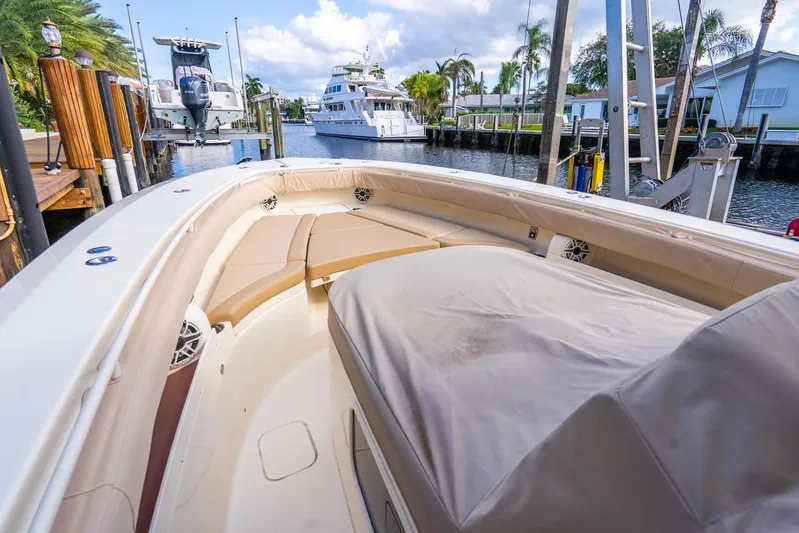 Yacht Photos Pics 2020 Scout 355 LXF boat docked in a scenic marina setting.