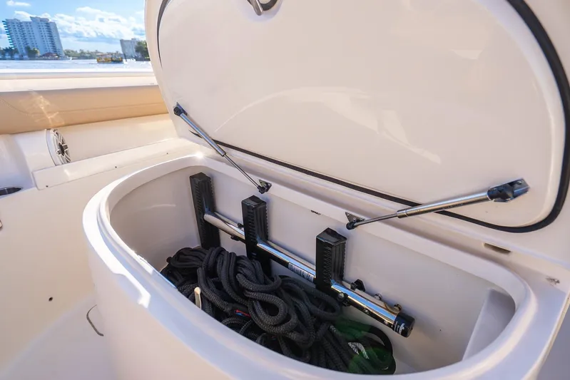  Yacht Photos Pics 2020 Scout 355 LXF boat storage compartment with ropes and equipment.