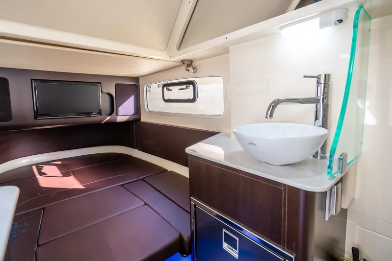  Yacht Photos Pics Luxurious interior of 2020 Scout 355 LXF boat with modern amenities and sleek design.