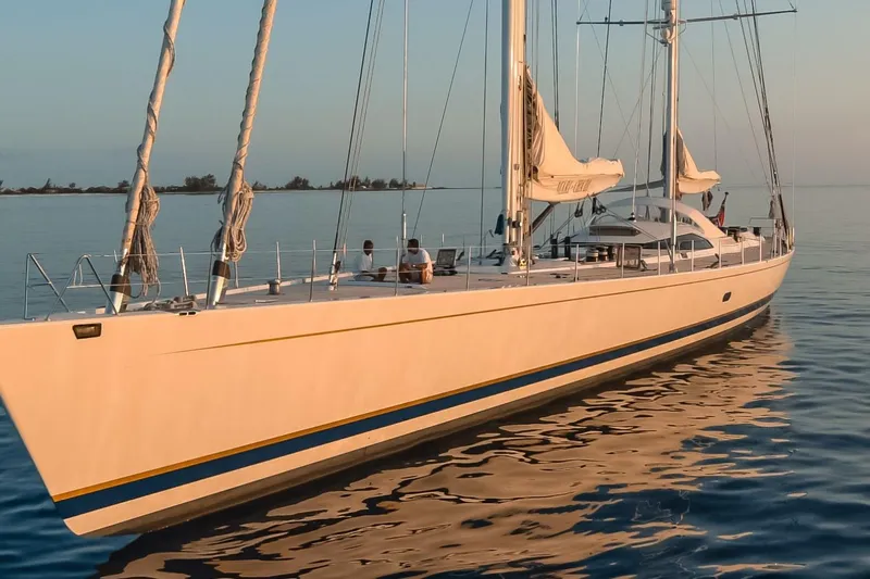 Mari Cha III Yacht Photos Pics Luxurious 1997 Sensation Yacht Custom sailing on calm waters at sunset.