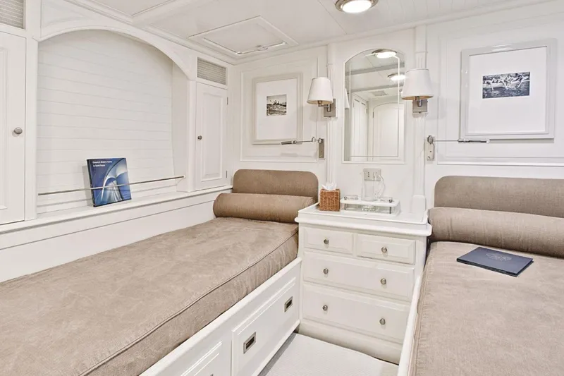 Mari Cha III Yacht Photos Pics Luxurious 1997 Sensation Yacht custom cabin with twin beds and elegant decor.