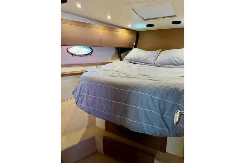 Yacht Photos Pics Cozy bedroom interior of 2011 Azimut Atlantis 40 yacht with modern design.