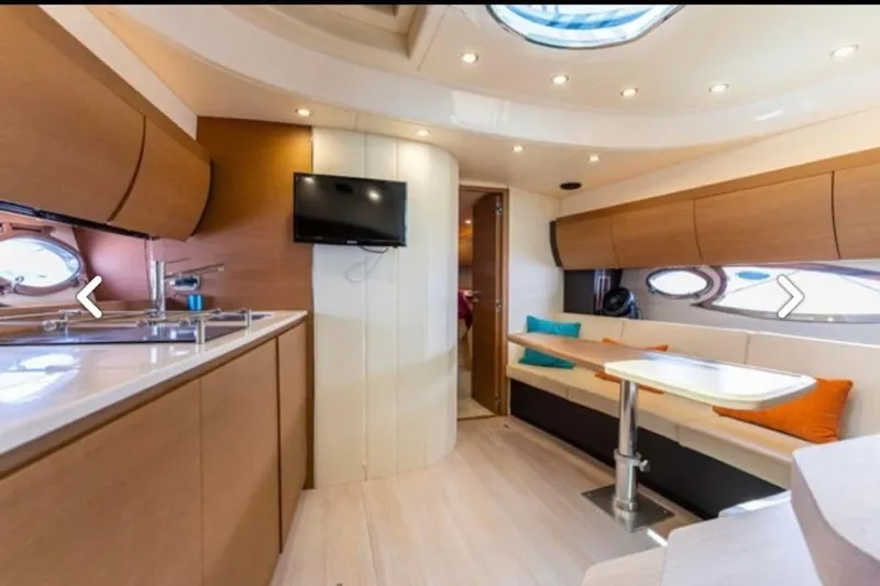  Yacht Photos Pics Luxurious interior of 2011 Azimut Atlantis 40 yacht with modern kitchen and seating area.