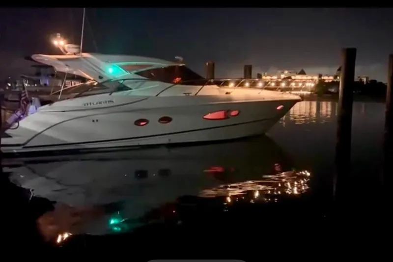  Yacht Photos Pics 2011 Azimut Atlantis 40 yacht docked at night, illuminated by ambient lights.
