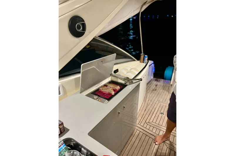  Yacht Photos Pics Outdoor kitchen on 2011 Azimut Atlantis 40 yacht with grill and wooden deck.