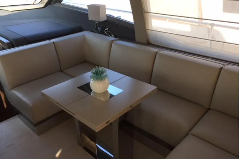  Yacht Photos Pics Luxurious interior of 2017 Ferreti 550 yacht with beige seating and modern decor.