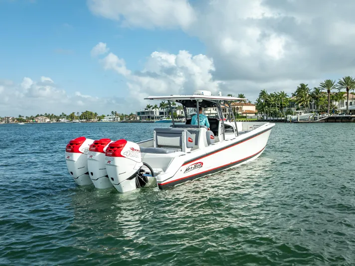 Yacht Photos Pics 2018 Nor-Tech 390 boat with triple engines cruising on a sunny day.