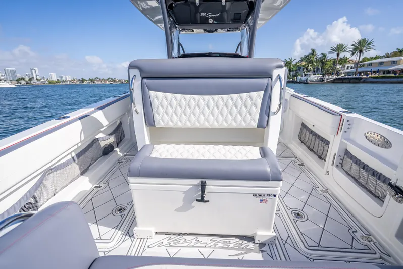  Yacht Photos Pics 2018 Nor-Tech 390 boat interior with luxury seating and scenic waterfront view.