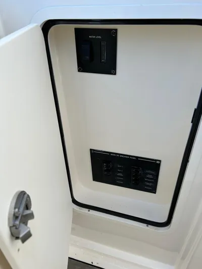  Yacht Photos Pics 2023 Sea Ray SLX 310 OB electrical panel with open access door.