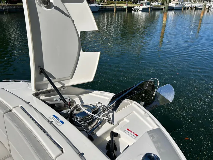  Yacht Photos Pics 2023 Sea Ray SLX 310 OB boat anchor system by the water.