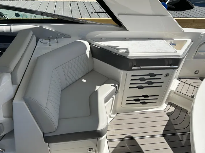  Yacht Photos Pics 2023 Sea Ray SLX 310 OB interior with luxurious seating and sleek design.