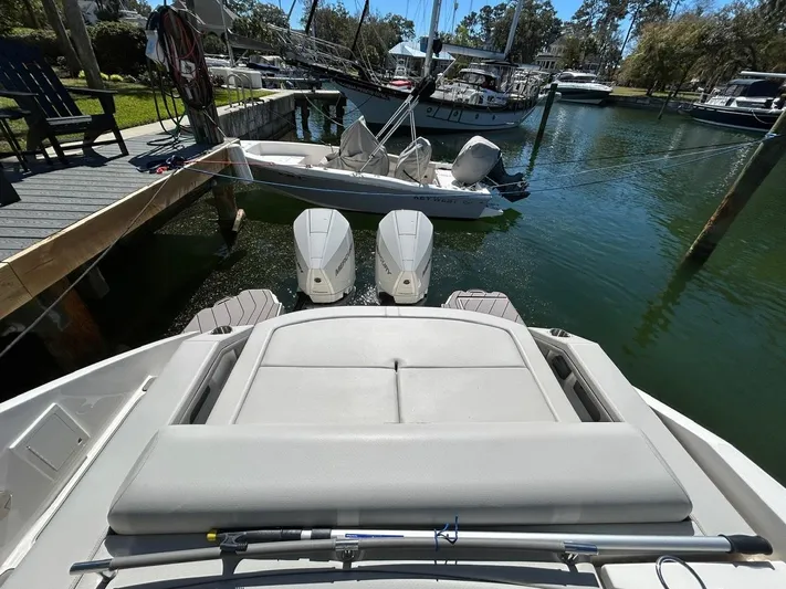  Yacht Photos Pics 2023 Sea Ray SLX 310 OB boat docked with twin outboard engines in a marina.