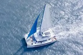  Yacht Photos Pics 2025 Heysea Seaview 50 catamaran sailing on open water with blue sails.