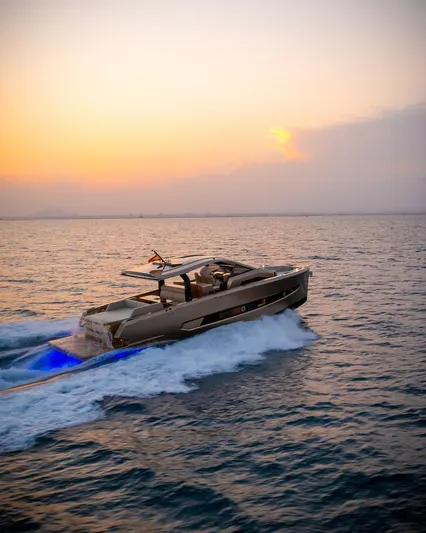  Yacht Photos Pics 2025 Tesoro T50 Armani Casa Speciale yacht cruising at sunset.