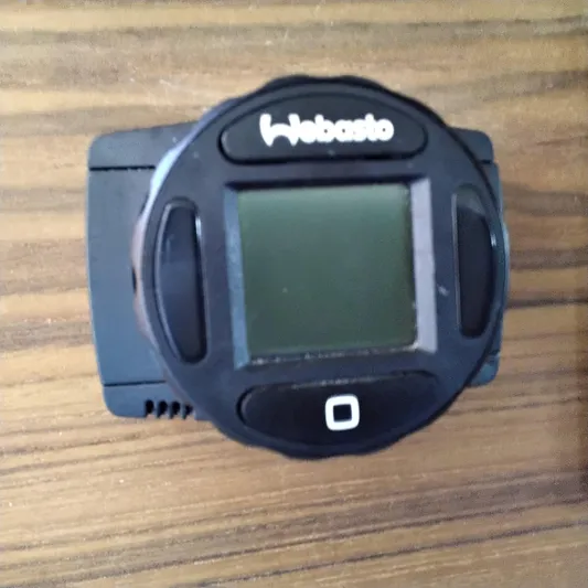  Yacht Photos Pics Webasto control panel on 2023 Ranger Tugs R-25 boat, mounted on wooden surface.