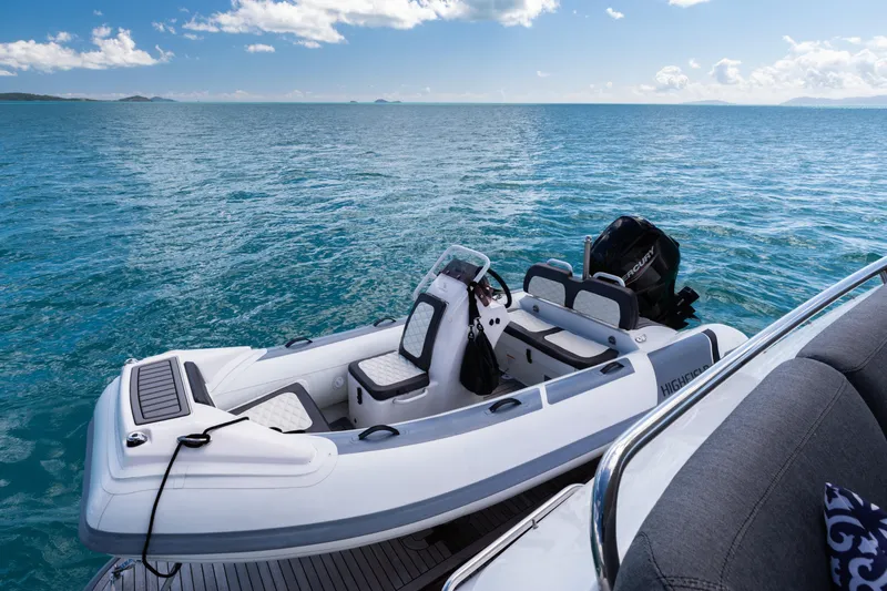 About Time Yacht Photos Pics Luxury yacht with tender boat on open sea, Princess Flybridge 72, 2014 model.