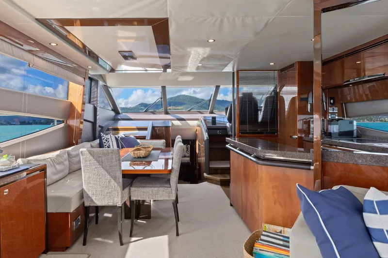 About Time Yacht Photos Pics Luxurious interior of 2014 Princess Flybridge 72 Motor Yacht with elegant dining area and scenic views.