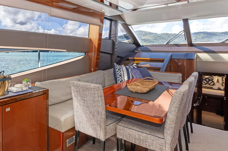 About Time Yacht Photos Pics Luxurious interior of 2014 Princess Flybridge 72 Motor Yacht with elegant dining area.