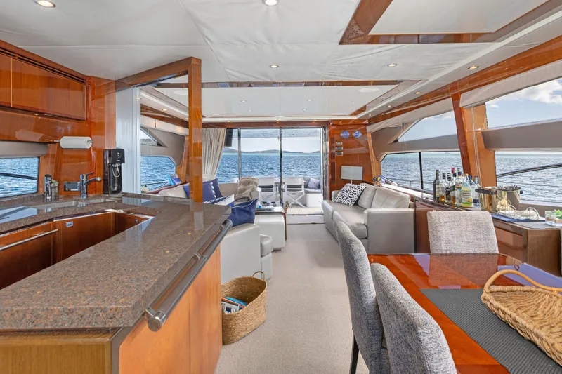 About Time Yacht Photos Pics Luxurious interior of 2014 Princess Flybridge 72 Motor Yacht with elegant dining and lounge area.