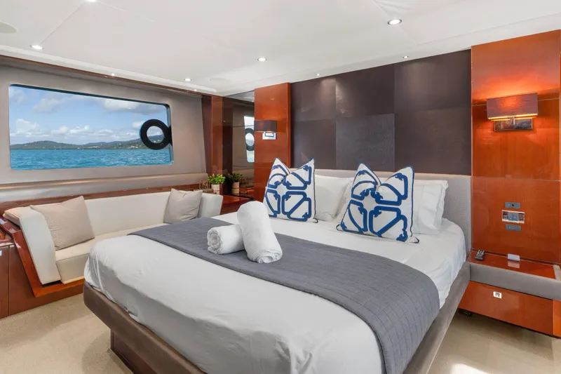 About Time Yacht Photos Pics Luxurious bedroom interior of 2014 Princess Flybridge 72 Motor Yacht with ocean view.