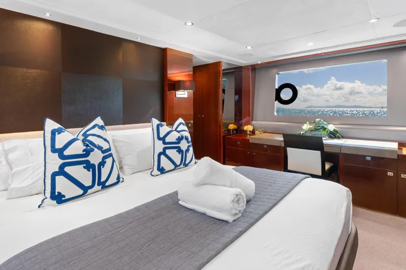 About Time Yacht Photos Pics Luxurious bedroom interior of 2014 Princess Flybridge 72 Motor Yacht with ocean view.