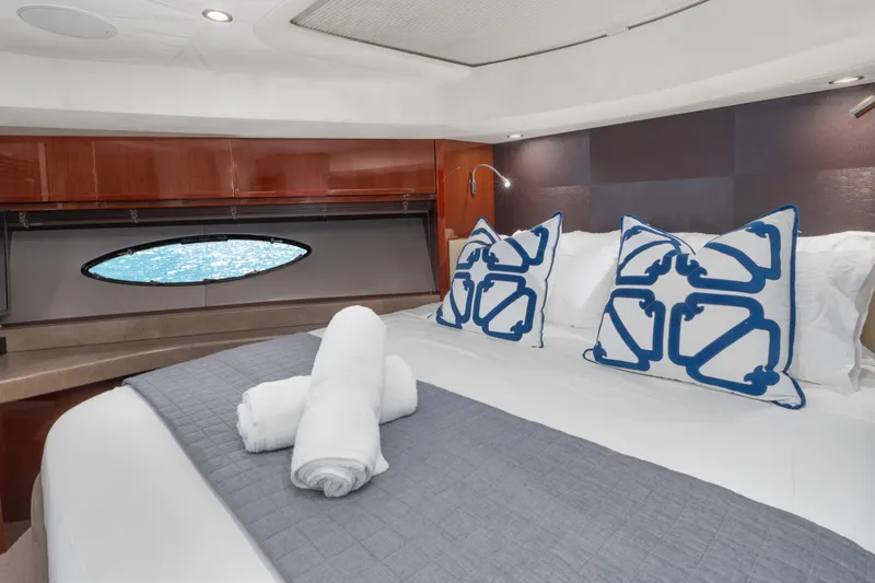 About Time Yacht Photos Pics Luxurious bedroom interior of 2014 Princess Flybridge 72 Motor Yacht with elegant decor.