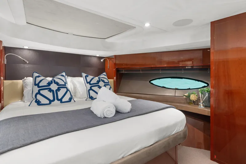 About Time Yacht Photos Pics Luxurious bedroom interior of 2014 Princess Flybridge 72 Motor Yacht with elegant decor.