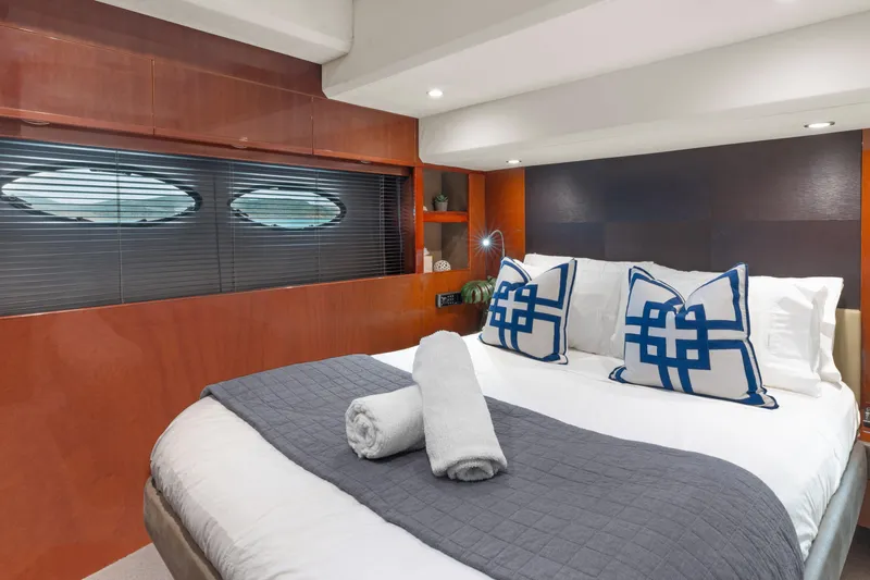 About Time Yacht Photos Pics Luxurious bedroom interior of 2014 Princess Flybridge 72 Motor Yacht with elegant decor.