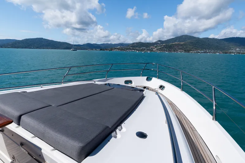 About Time Yacht Photos Pics Luxurious 2014 Princess Flybridge 72 Motor Yacht with sunbathing deck, scenic ocean view.