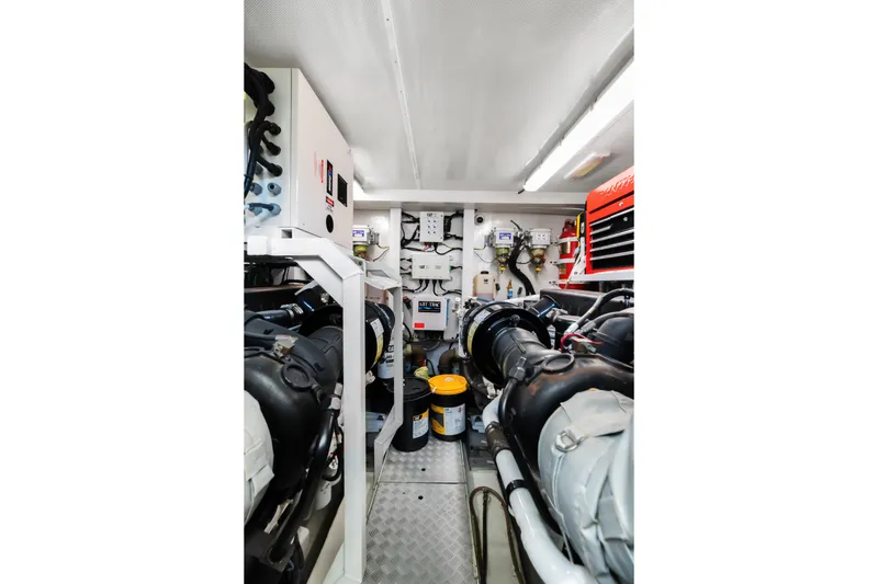 About Time Yacht Photos Pics Engine room of 2014 Princess Flybridge 72 Motor Yacht, showcasing machinery and equipment.