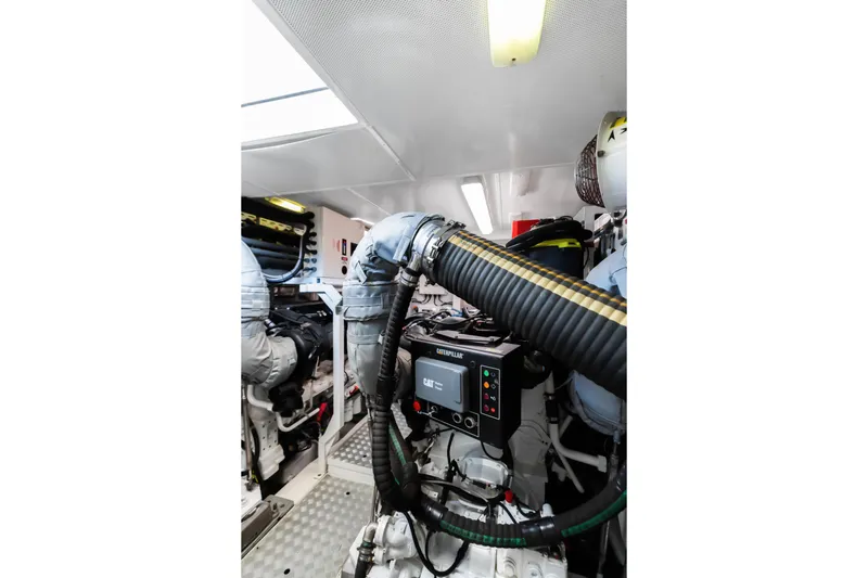 About Time Yacht Photos Pics Engine room of 2014 Princess Flybridge 72 Motor Yacht, featuring Caterpillar machinery.