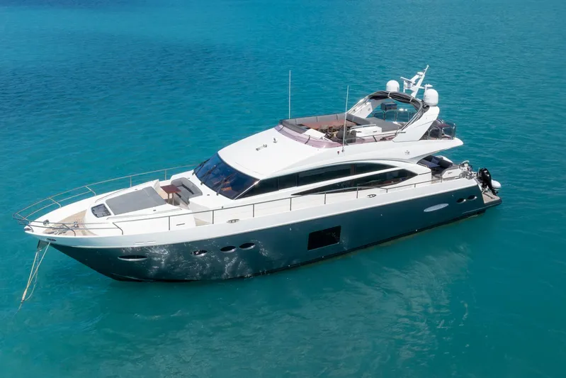 About Time Yacht Photos Pics 2014 Princess Flybridge 72 Motor Yacht on clear blue water.