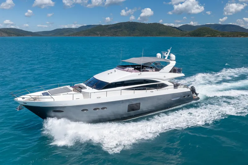 About Time Yacht Photos Pics 2014 Princess Flybridge 72 Motor Yacht cruising on blue ocean waters.