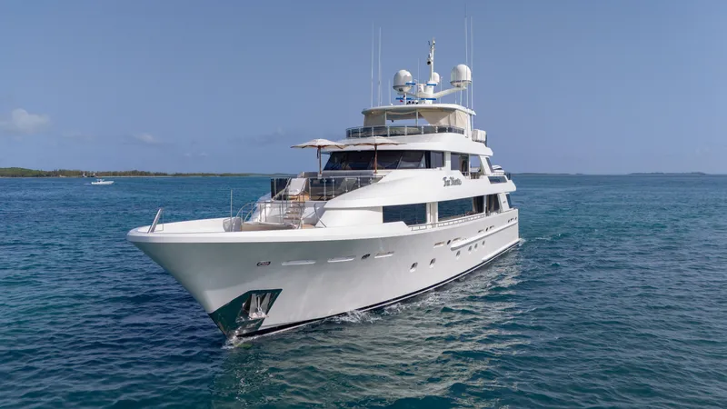 Far Niente Yacht Photos Pics Luxurious 2014 Westport 40M yacht cruising on clear blue waters.